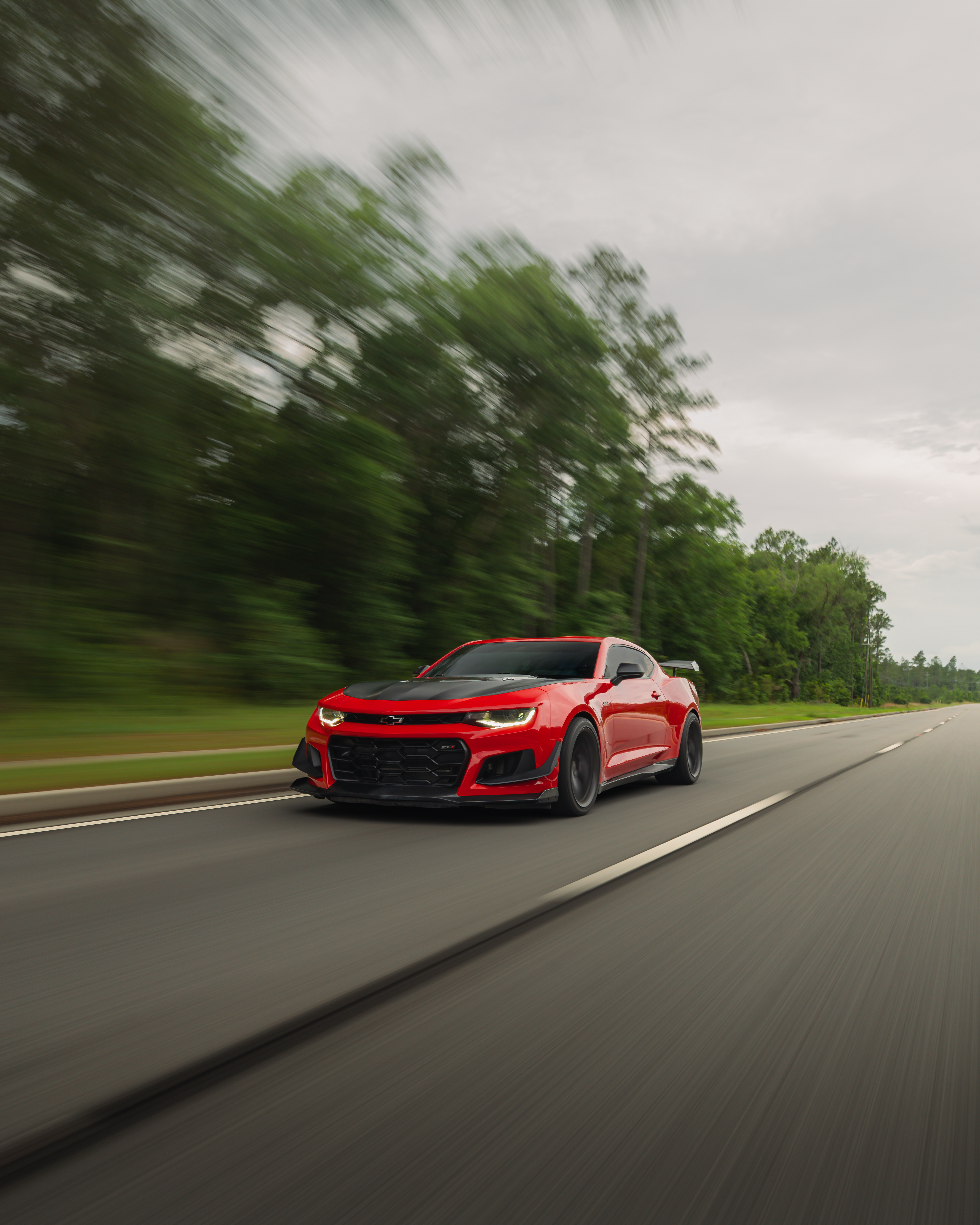 Dynamic Red Sports Car Speeding on Georgia Highway · Free Stock Photo