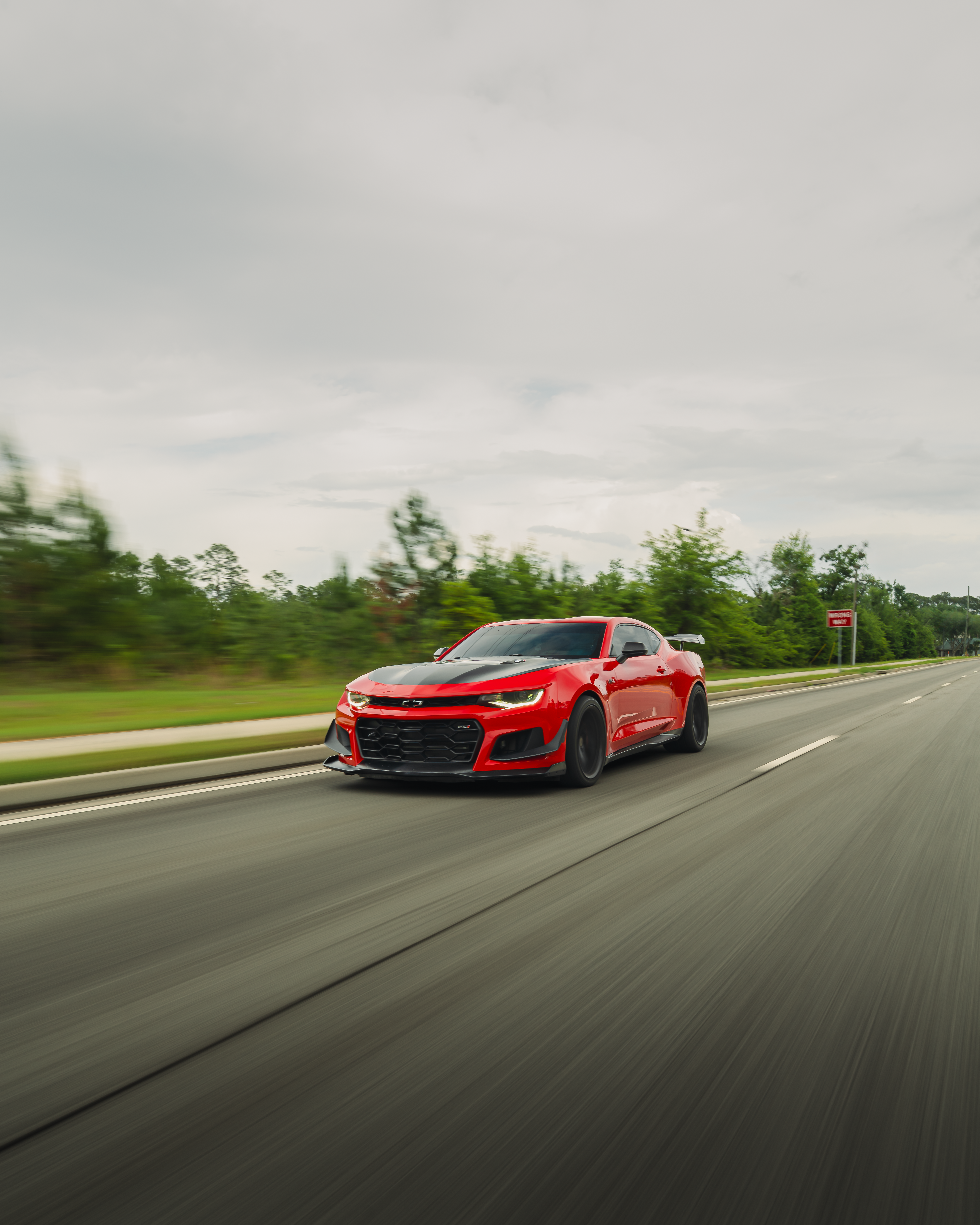 Red Chevrolet Camaro Driving on Georgia Highway · Free Stock Photo