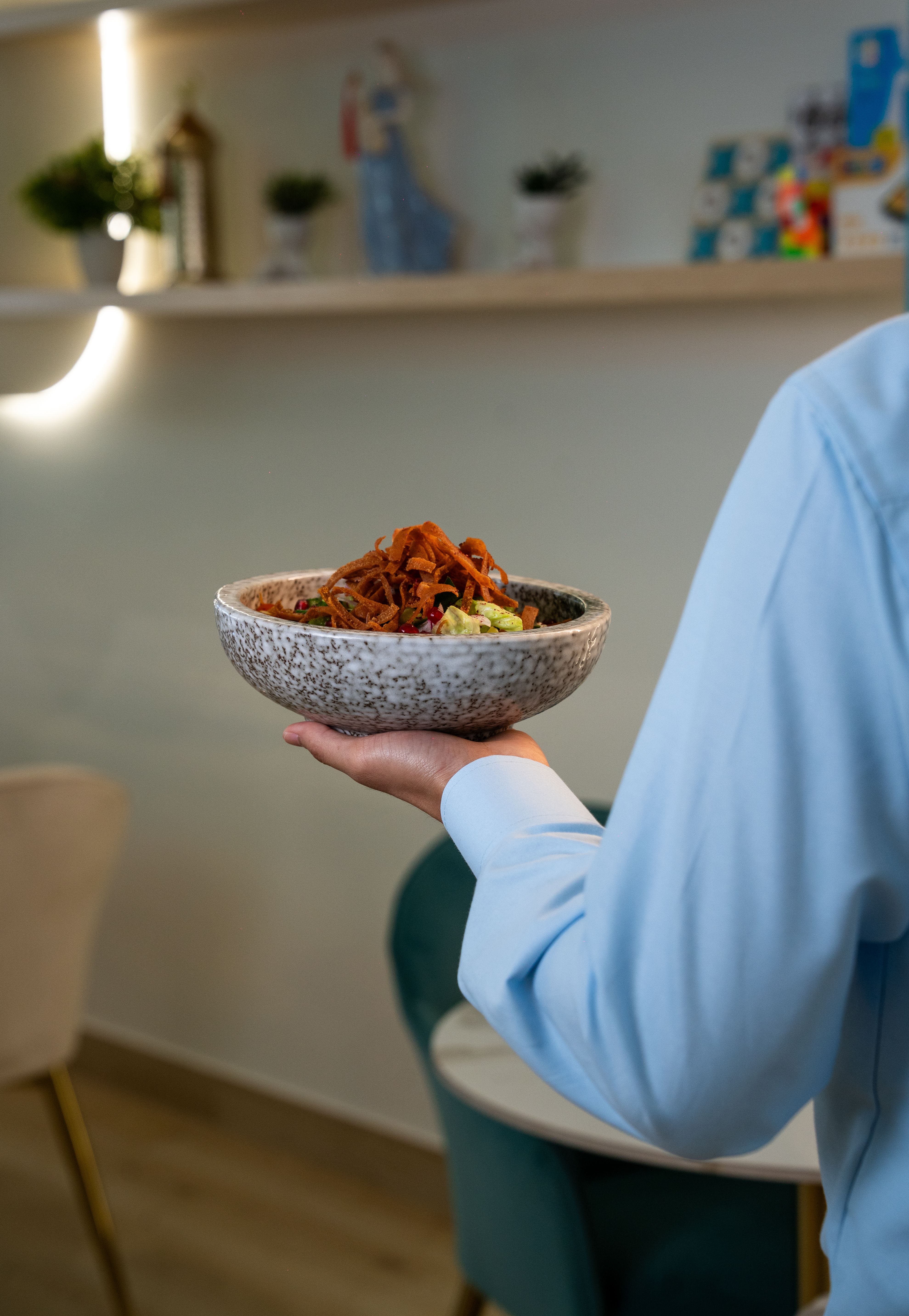 Restaurant server carrying a dish