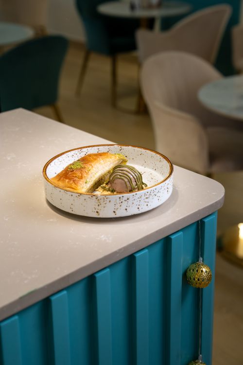 Free A delicious pastry dish beautifully presented in a stylish cafe setting. Stock Photo