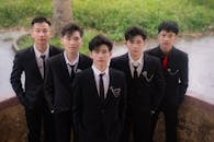 Group of Young Men in Suits Outdoors