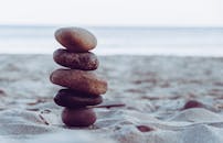 Tranquil Stacked Stones on a Serene Beach