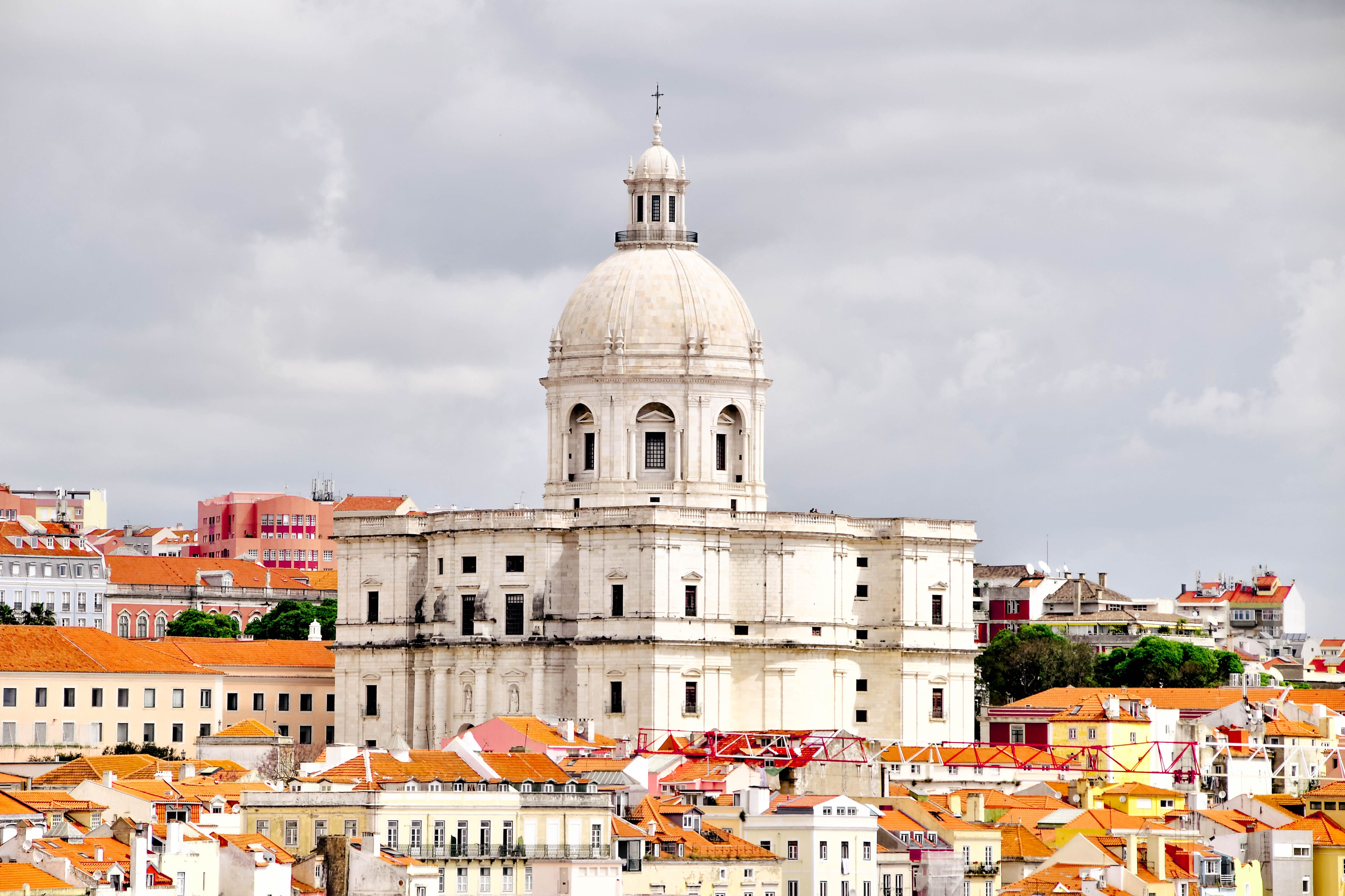 The majestic Panteão Nacional set against the colorful rooftops of Lisbon, Portugal.