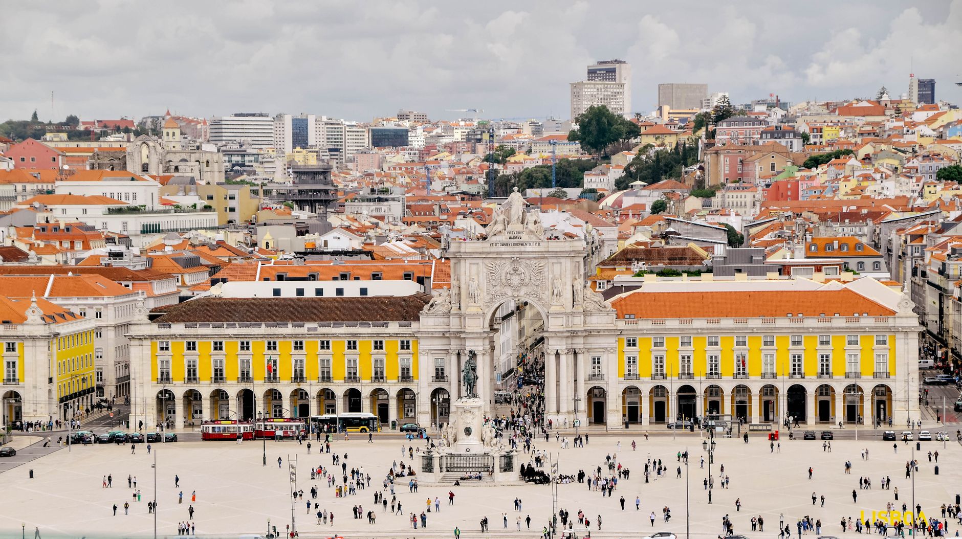 Aerial view of Praça do Comércio in Lisbon, showcasing the iconic arch and bustling square.