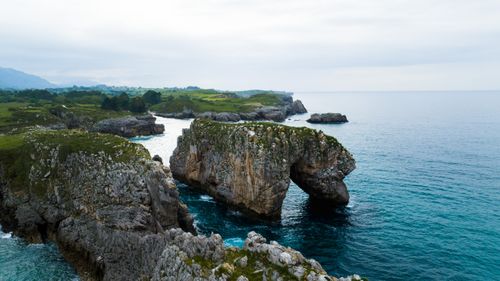 Free Beautiful rocky coastline and arch formations in Northern Spain Stock Photo