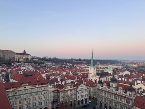 Free Aerial view of Prague Old Town with red roofs and church spire at twilight, Czech Republic. Stock Photo