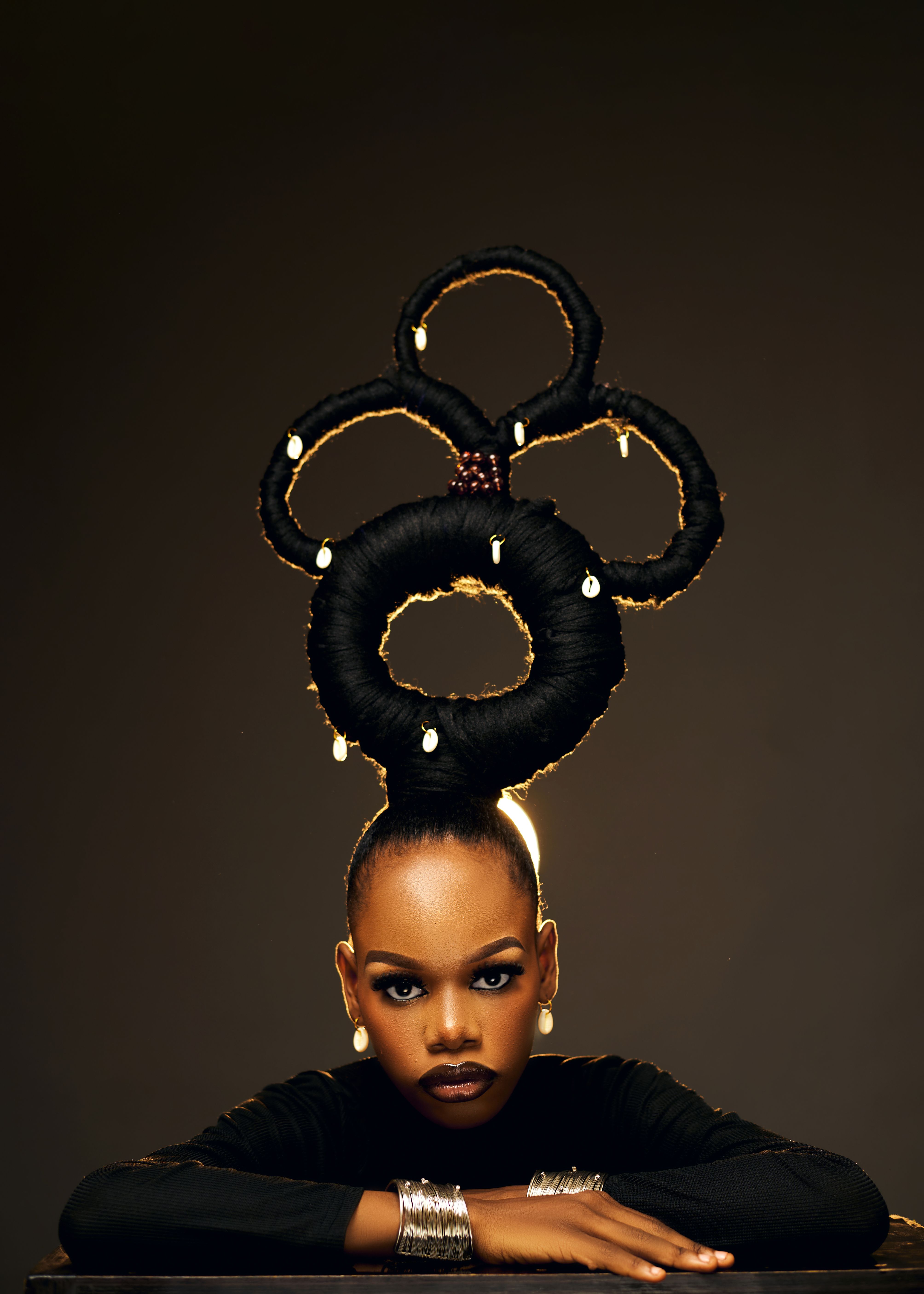 Striking portrait of a woman with intricate and artistic hairstyle. A blend of fashion and creativity.