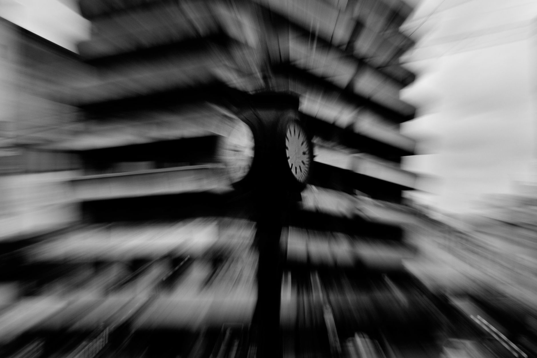 Creative black and white motion blur photo of a street clock in La Plata, Argentina.