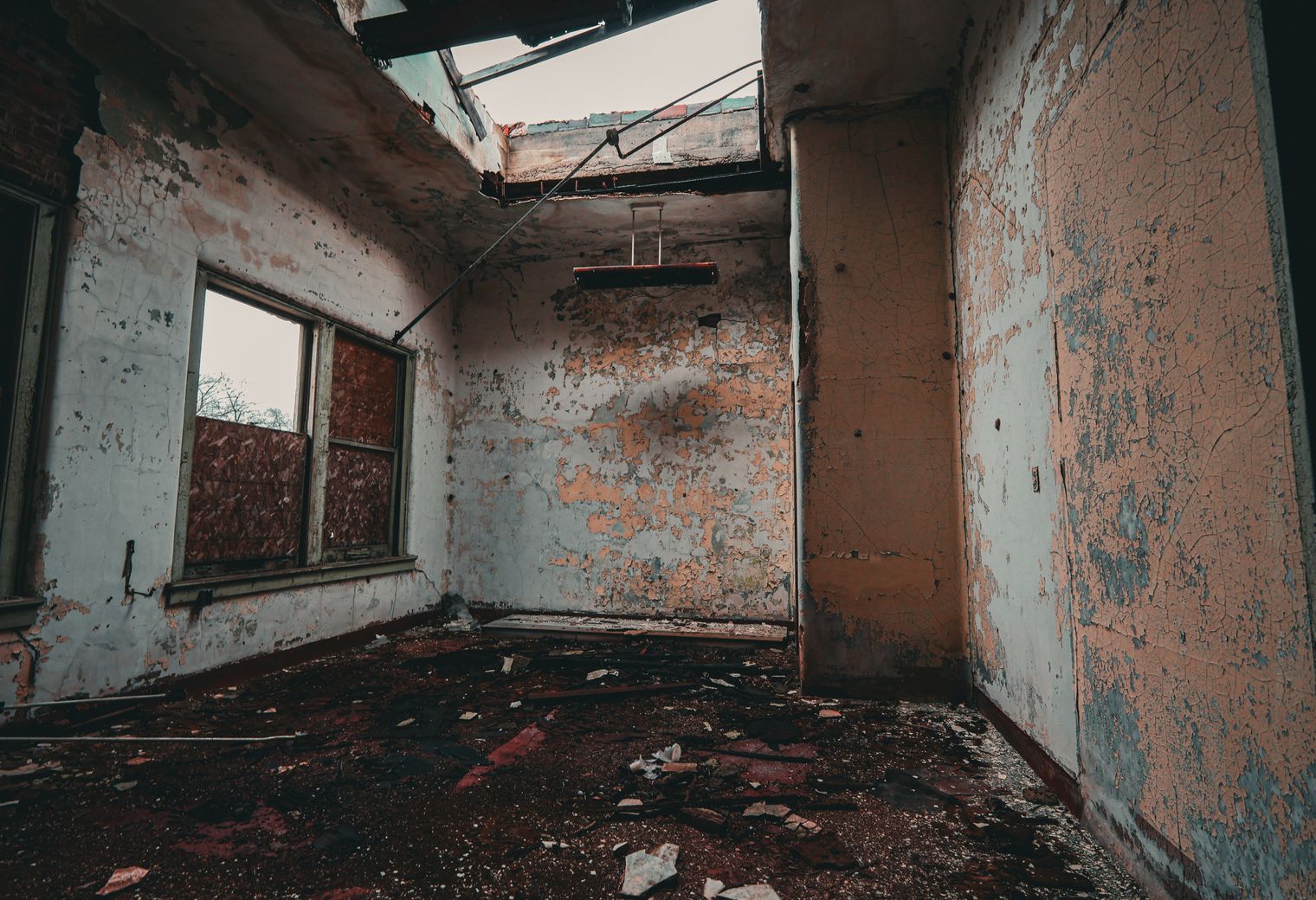 Plastering and Skimming in Wormwood Scrubs — a decorator at work mid-project