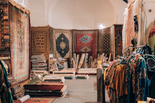 Free Explore intricate carpets and vibrant textiles in a Bukhara market shop. Stock Photo