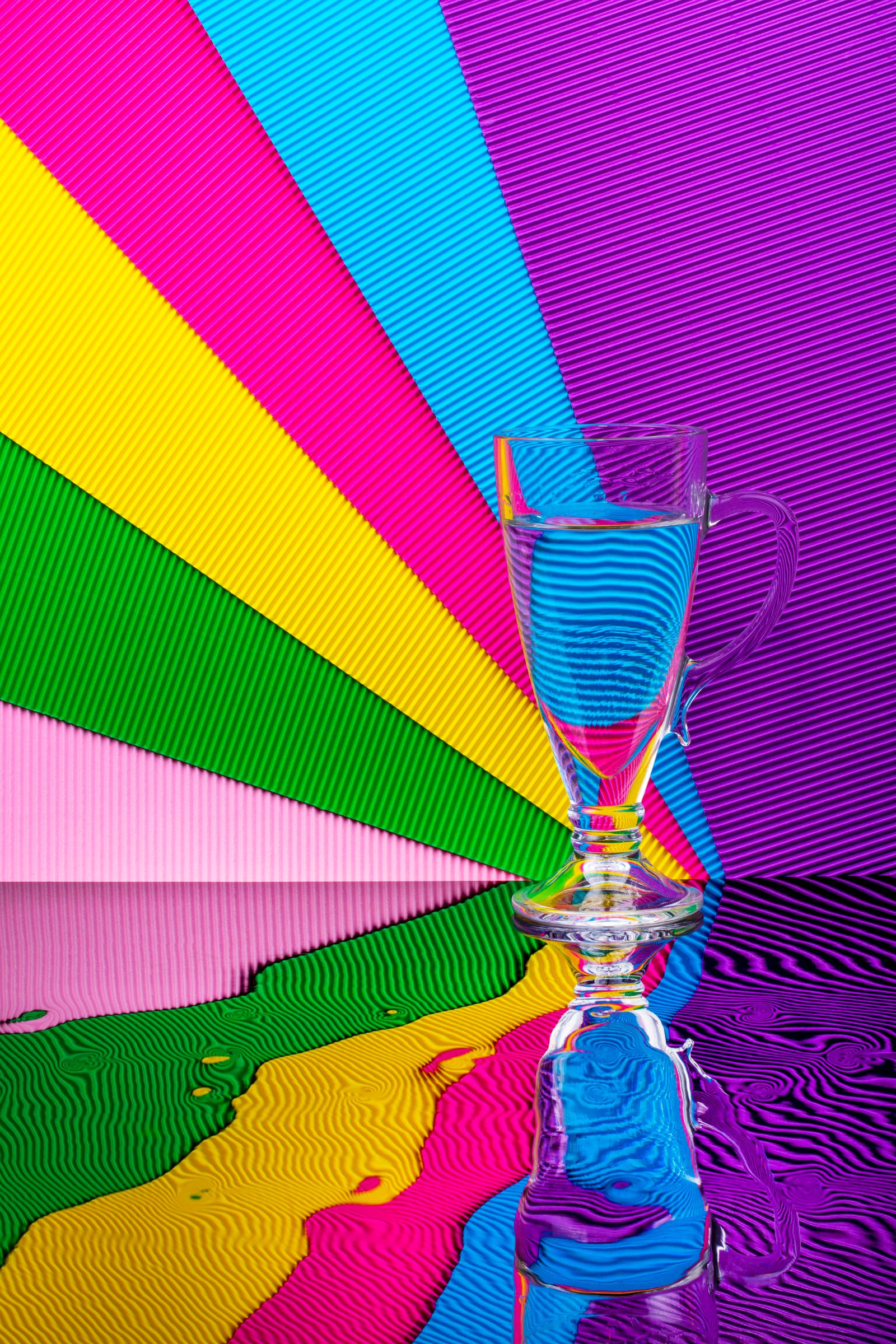Colourful layered reflections representing live state, redundant copies, backup history and off-site recovery.