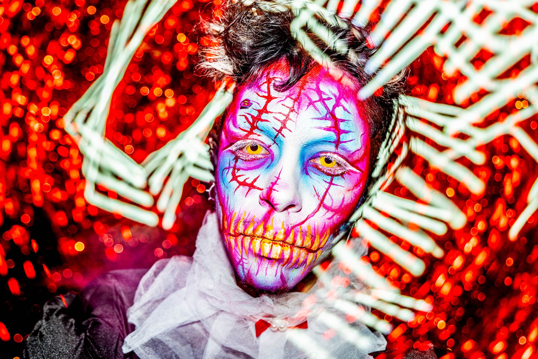 Colorful face paint art with intricate details in Tlaquepaque, capturing vibrant creativity.