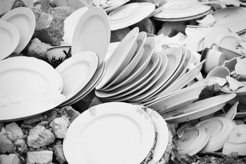 Free A collection of shattered and stacked plates creating an abstract pattern in monochrome. Stock Photo