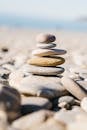 Serene Stack of Zen Stones on a Sunlit Beach