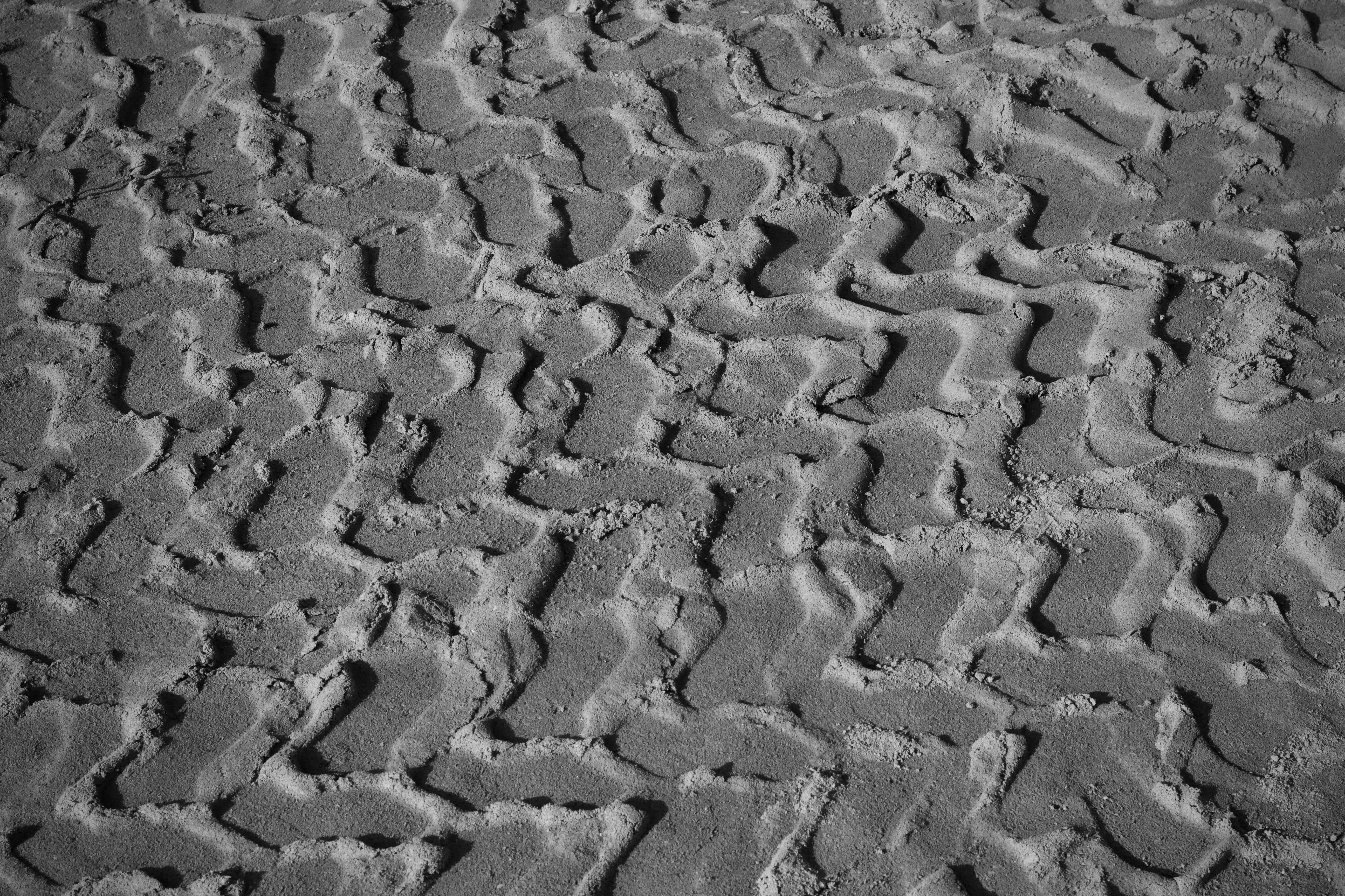 Free Abstract black and white photo of textured sand patterns, artistic and minimal. Stock Photo