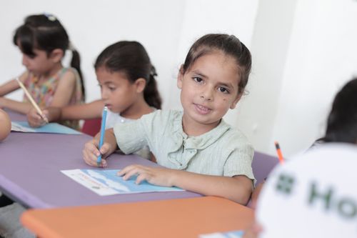 Free Young children participating in a classroom art session in Gaza, fostering creativity. Stock Photo