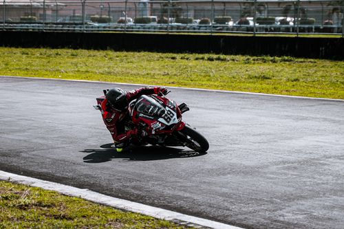 Free A motorcyclist takes a sharp turn on a race track in Angeles, Philippines. Stock Photo
