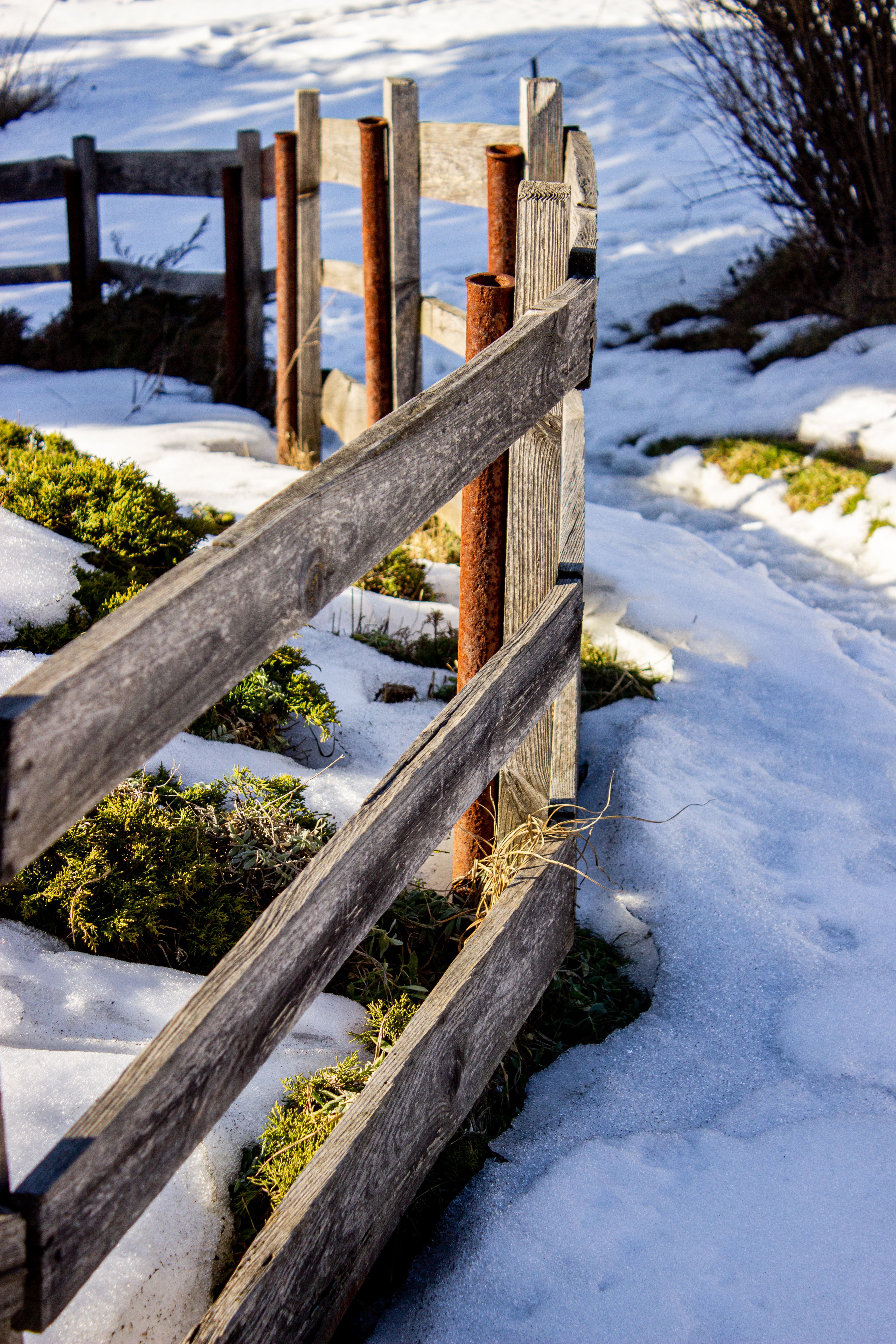 Rustic Wooden Fence Amid Snowy Landscape · Free Stock Photo