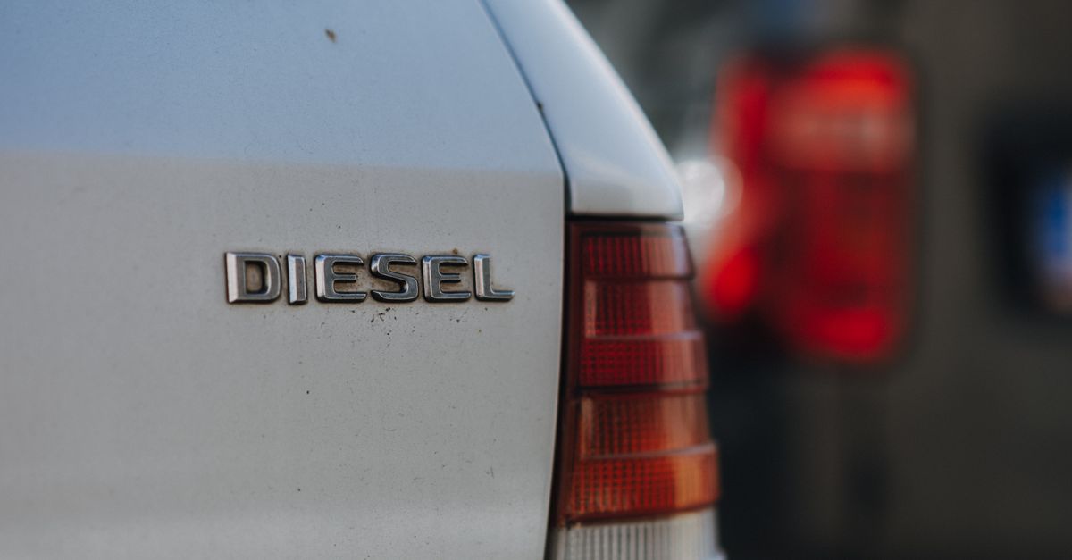 Detailed view of a diesel car badge with blurred background, captured in Prague.