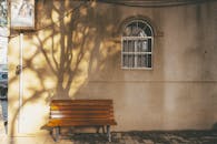 Peaceful Urban Bench with Tree Shadows