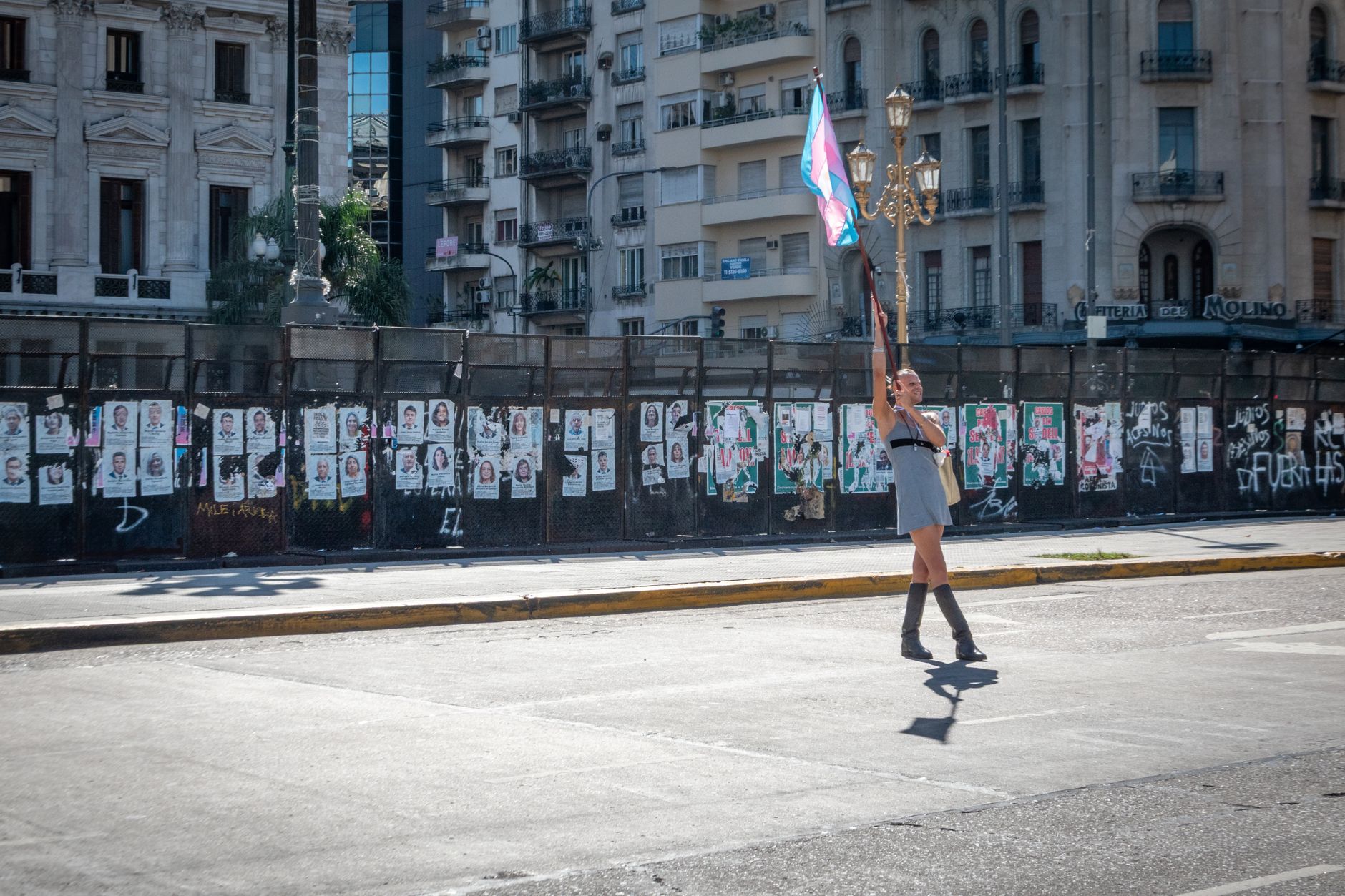 A person waves a flag during a protest in Buenos Aires, Argentina.