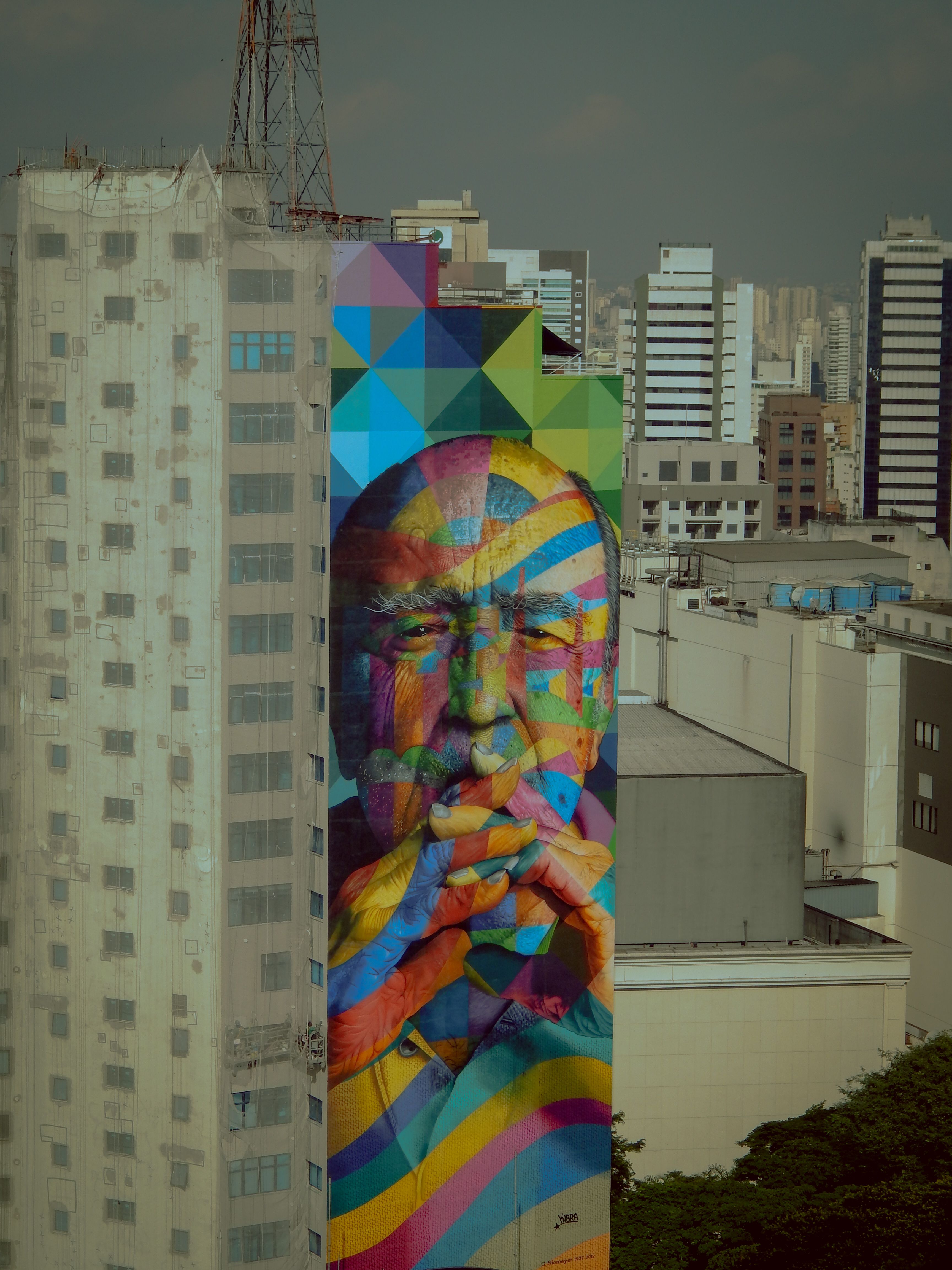 Colorful geometric mural on a building in São Paulo, Brazil. Urban street art scene.