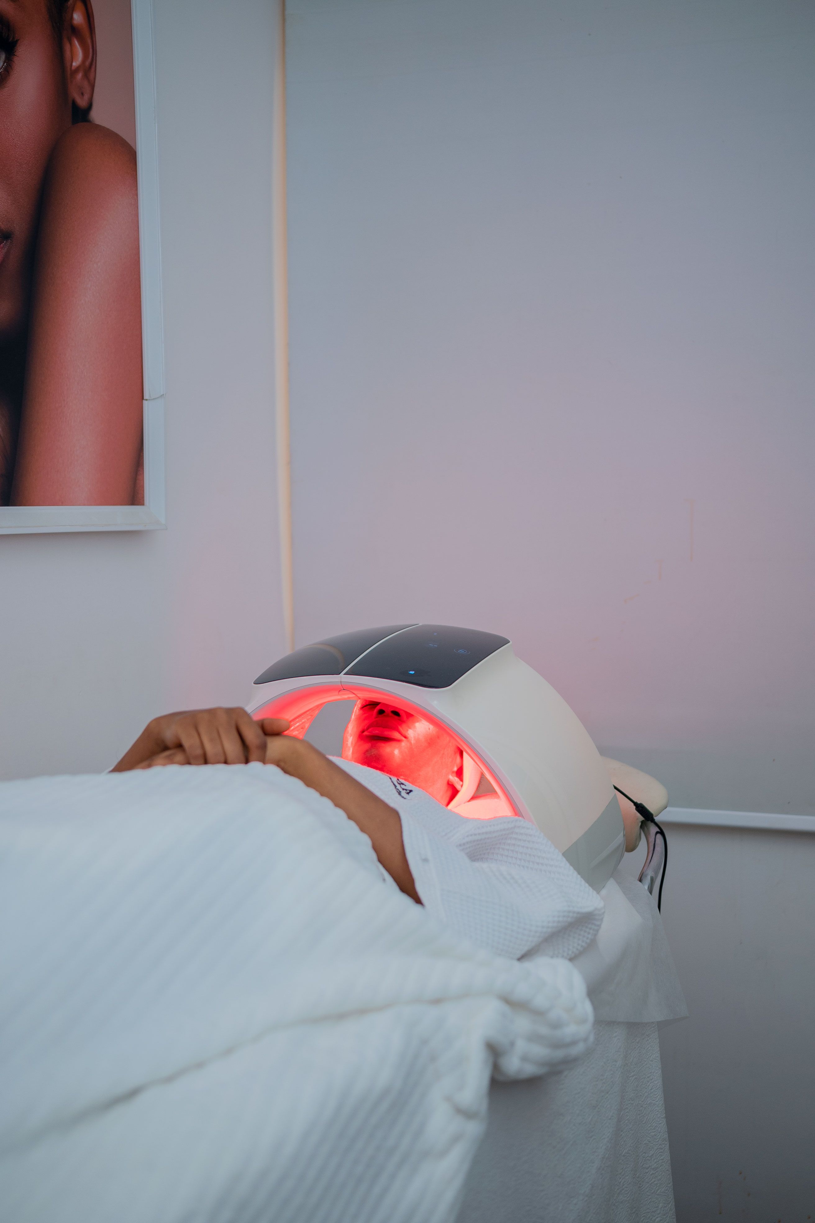 Woman receiving red light therapy on her face