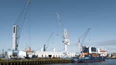 Industrial Cranes and Cargo Ship in Hamburg Port