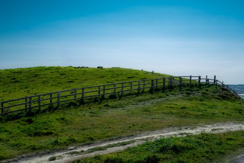 Free Peaceful countryside view in County Clare with lush green hills and clear blue sky. Stock Photo