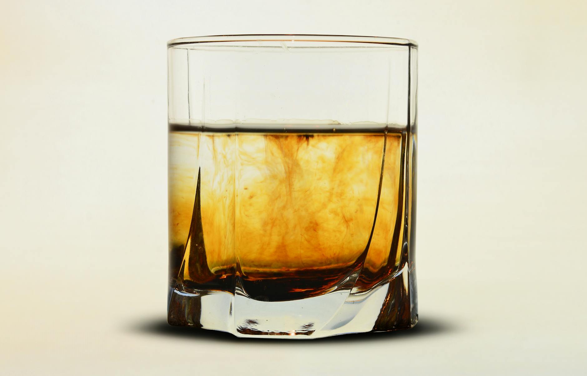 Honey flavored Jim Beam bourbon bottle with honey dipper