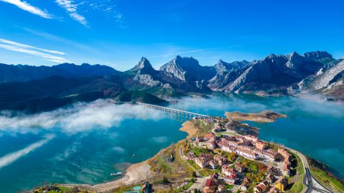 Free Stunning aerial shot of Riaño Lake and mountains in Castilla y León, Spain. Stock Photo
