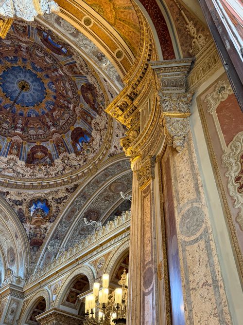 Free Ornate ceiling with detailed architecture inside a grand historical building. Stock Photo