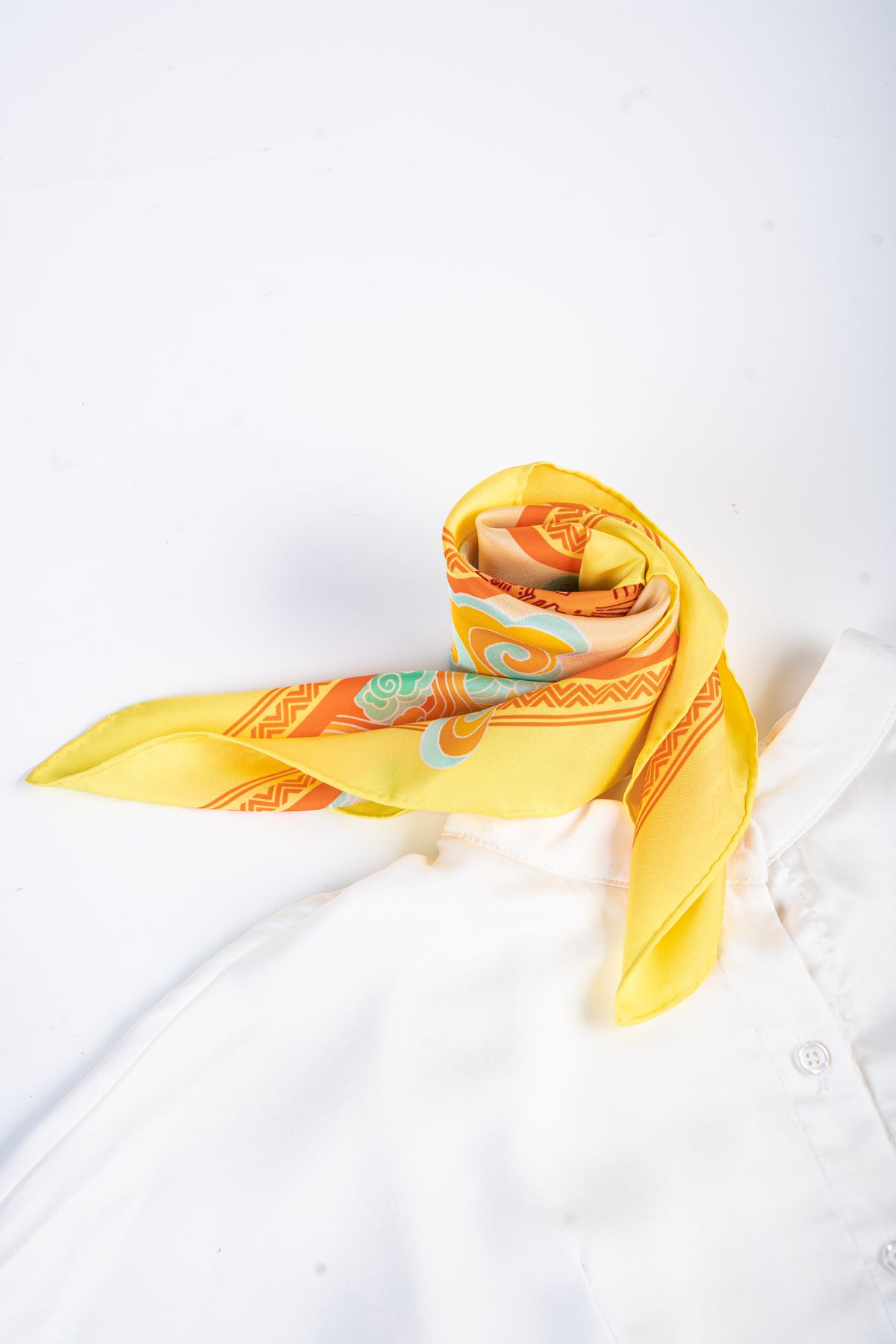 A silk scarf laid open across a white shirt