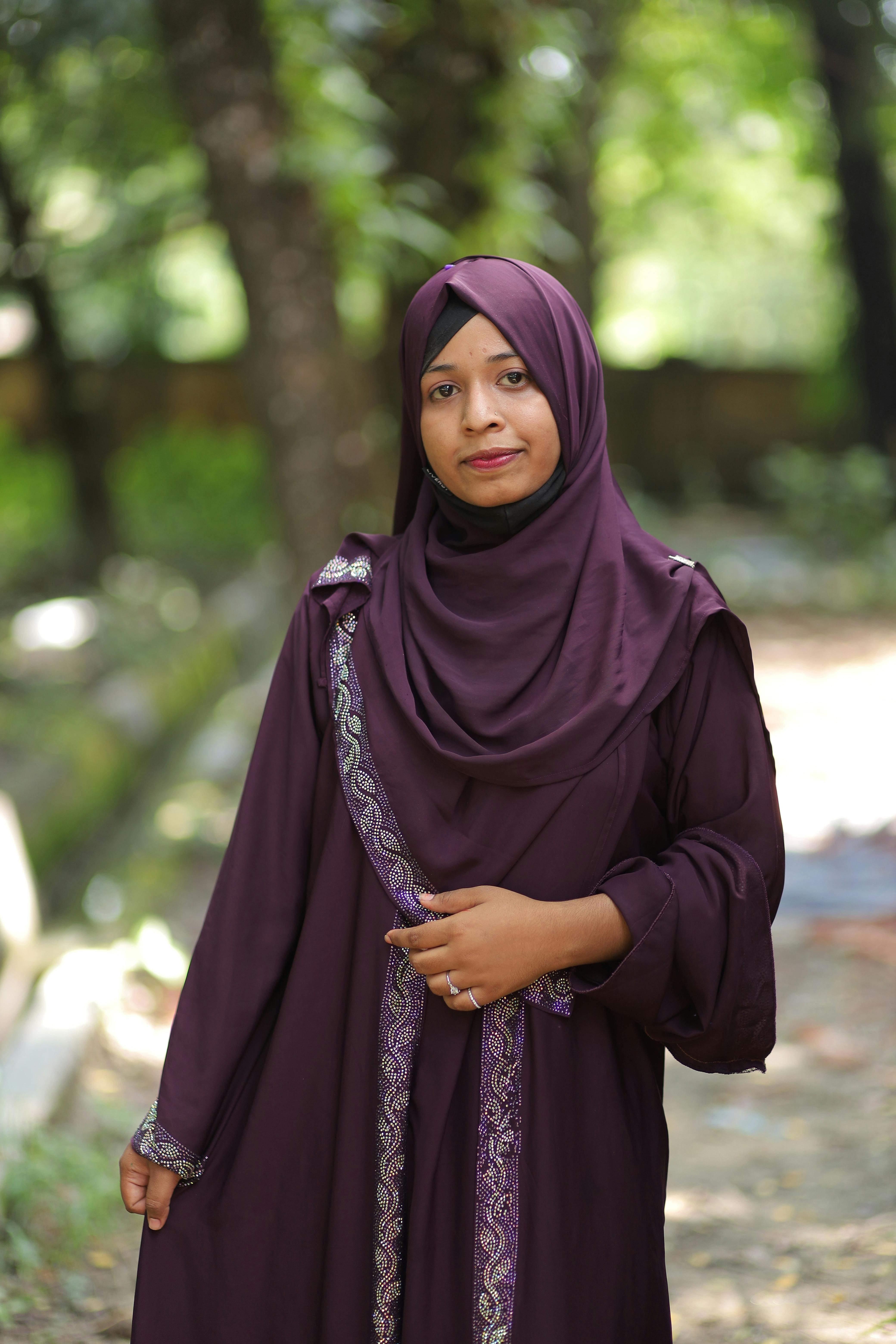 South Asian woman wearing a hijab in a natural setting in Bangladesh.