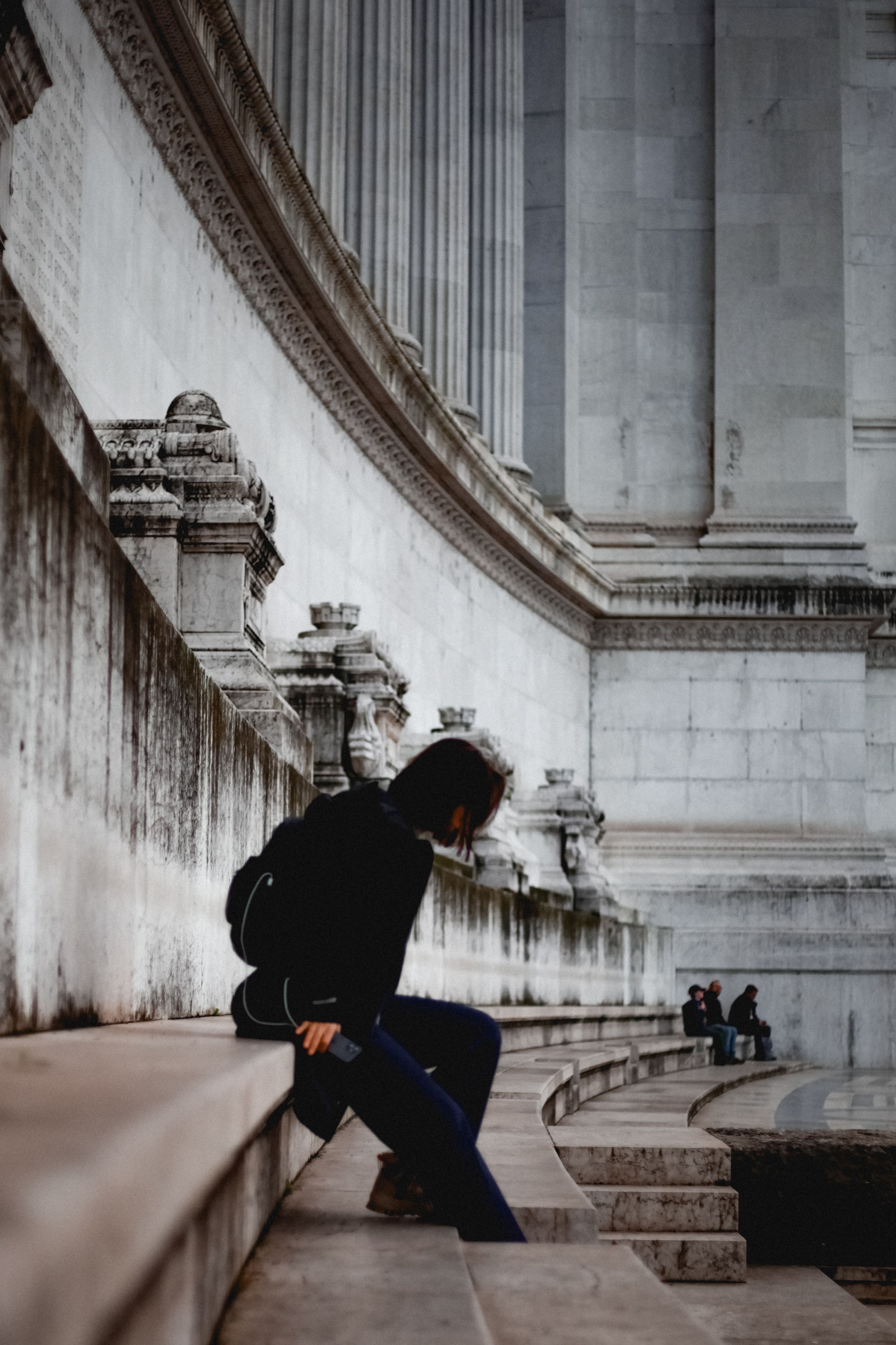Contemplative Moment on Historic Stone Steps · Free Stock Photo