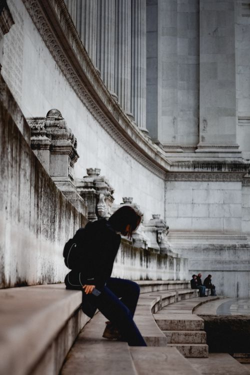 Contemplation Steps Contemplative Moment on Historic Stone Steps · Free Stock Photo