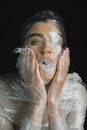 Woman Wrapped In Plastic