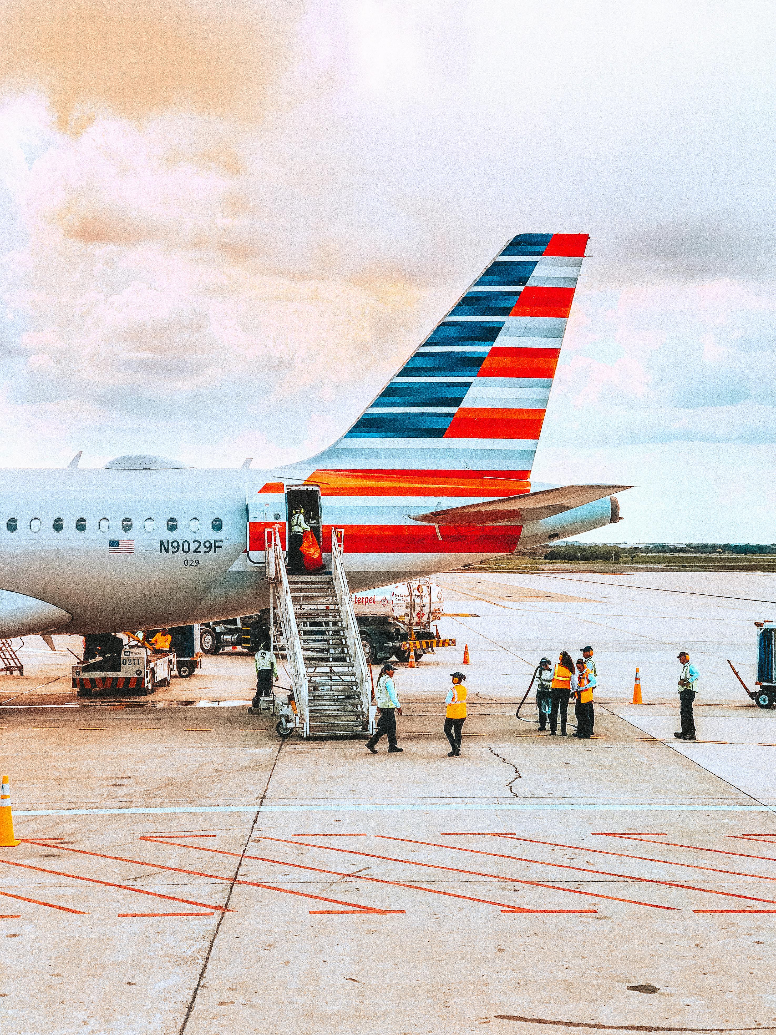 Free People Walking Near Airplane Stock Photo
