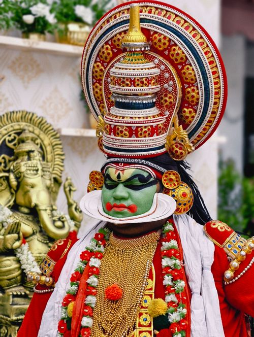Free A Kathakali performer in full traditional costume poses for a cultural festival photo. Stock Photo
