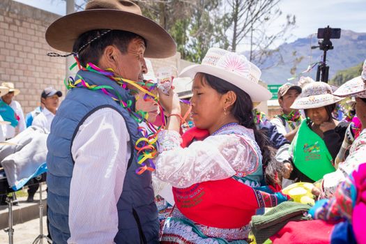 Traditional celebration with colorful costumes in Caylloma, Arequipa, Peru.
