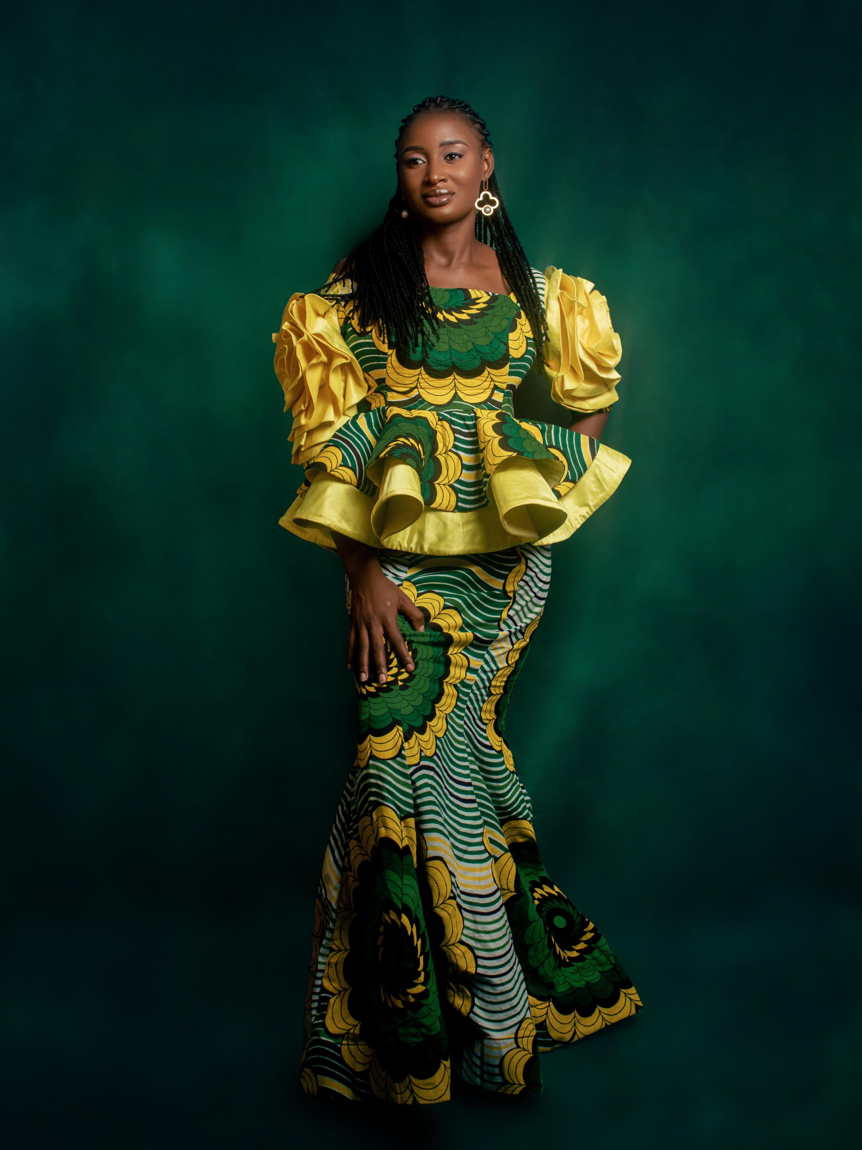 Elegant Woman in Colorful African Attire · Free Stock Photo