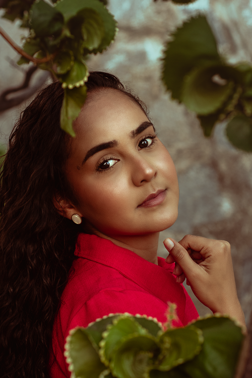 Free Stunning portrait of a woman in a lush garden setting in Recife, Brasil. Captivating and serene. Stock Photo