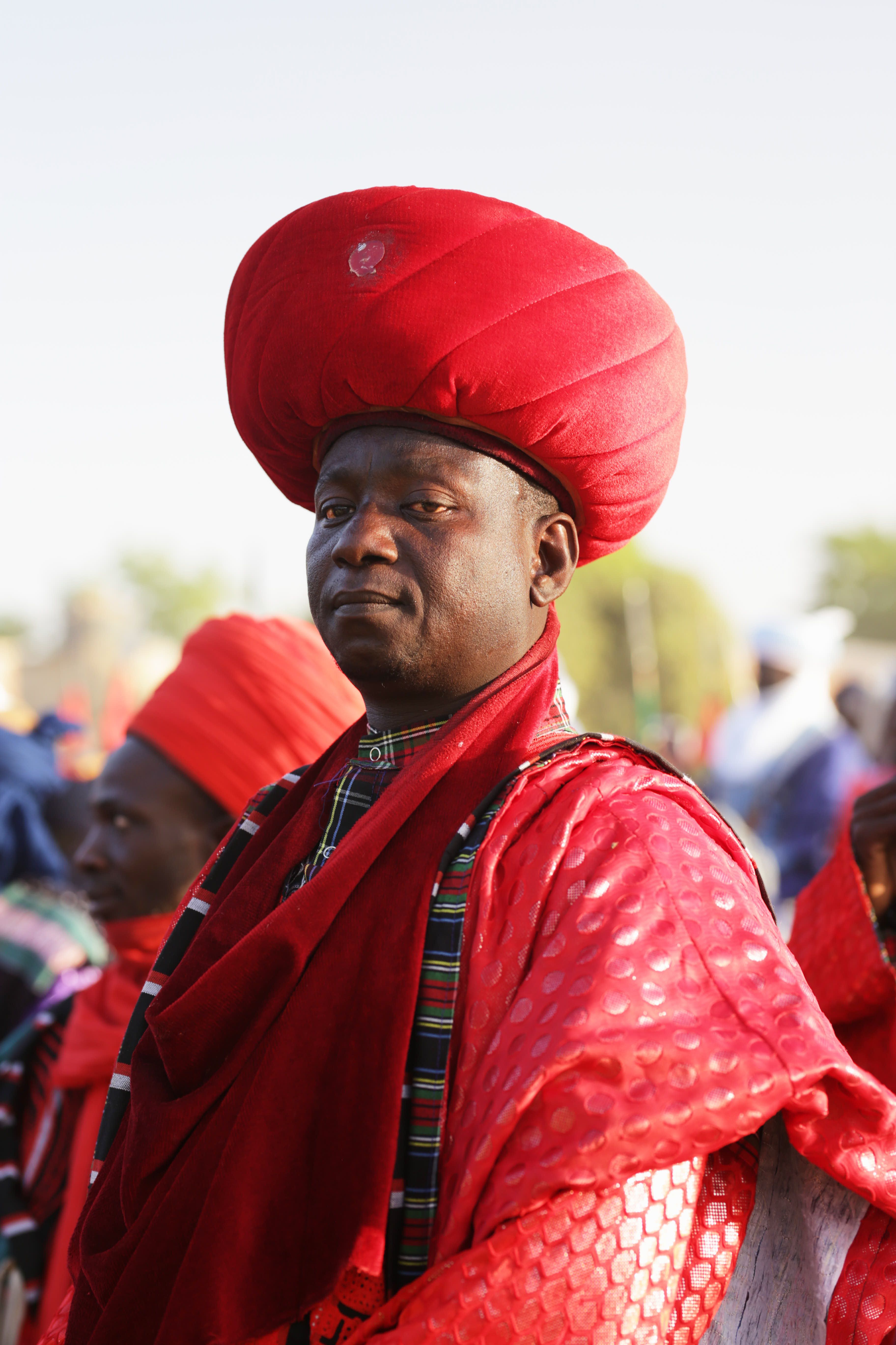 Man in traditional Nigerian attire at the Argungu Festival, showcasing vibrant cultural heritage.