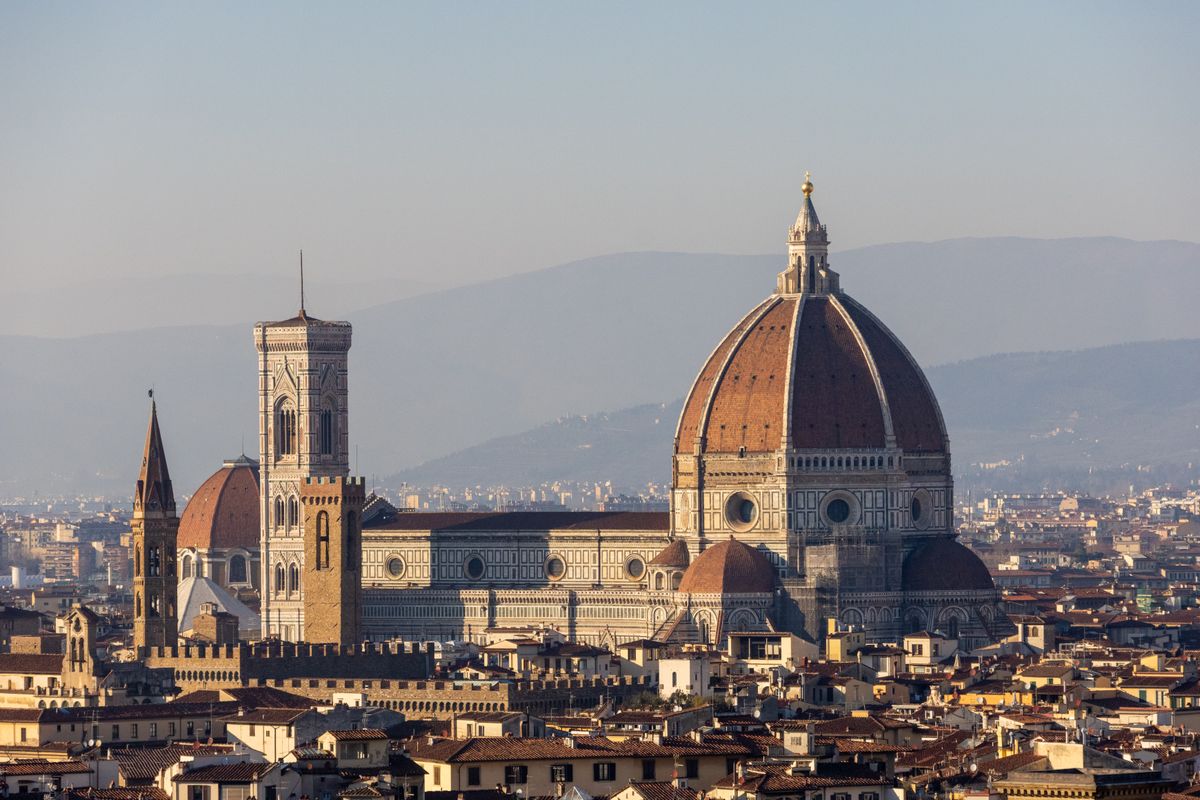 Aerial view of Brunelleschi terracotta dome with eight white marble ribs and lantern crowning Florence Cathedral