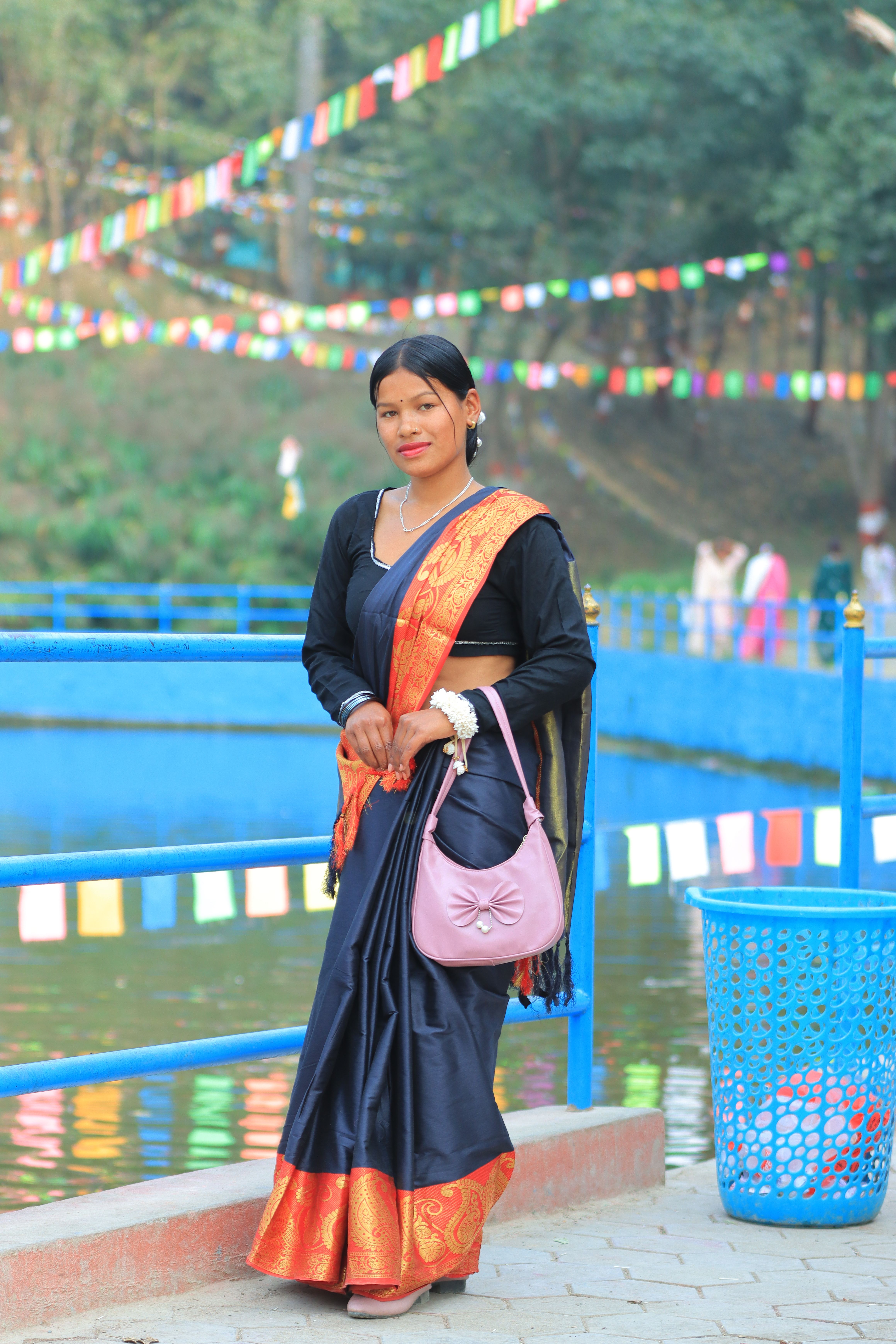 Woman in Traditional Sari by Colorful River Scene · Free Stock Photo