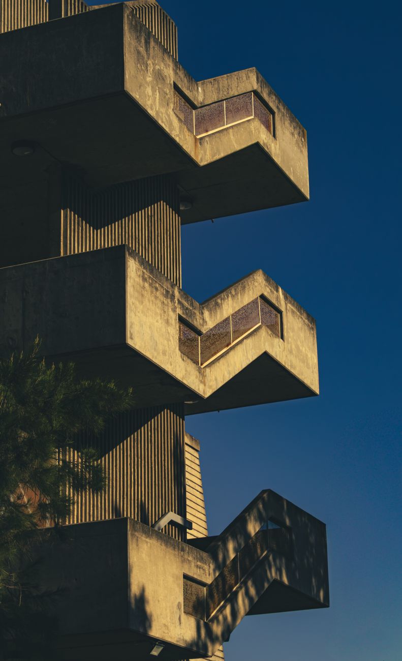 Stunning brutalist architecture in Melbourne, captured with dramatic shadows at dawn.. stunning, brutalist, architecture