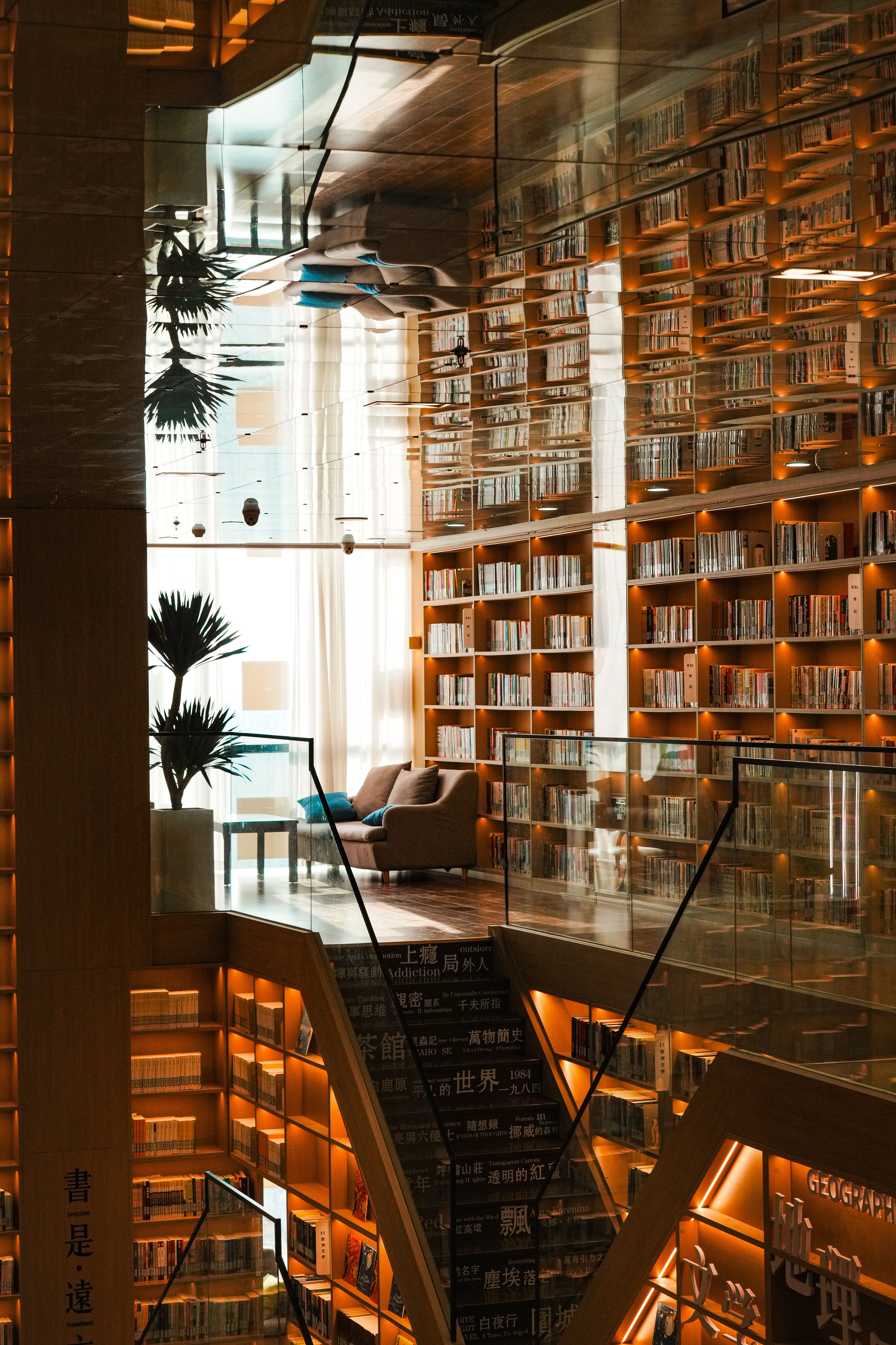 Modern Library with Floating Stairs and Bookshelves · Free Stock Photo