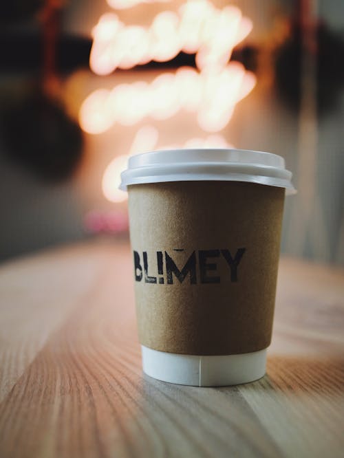 Free Disposable Cup on Brown Wooden Table Stock Photo