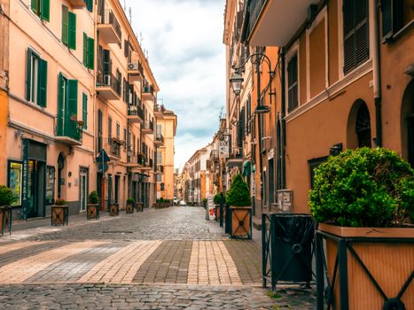 A quiet Italian street with pastel facades and cobblestone pavement, exuding serenity and Mediterranean charm.