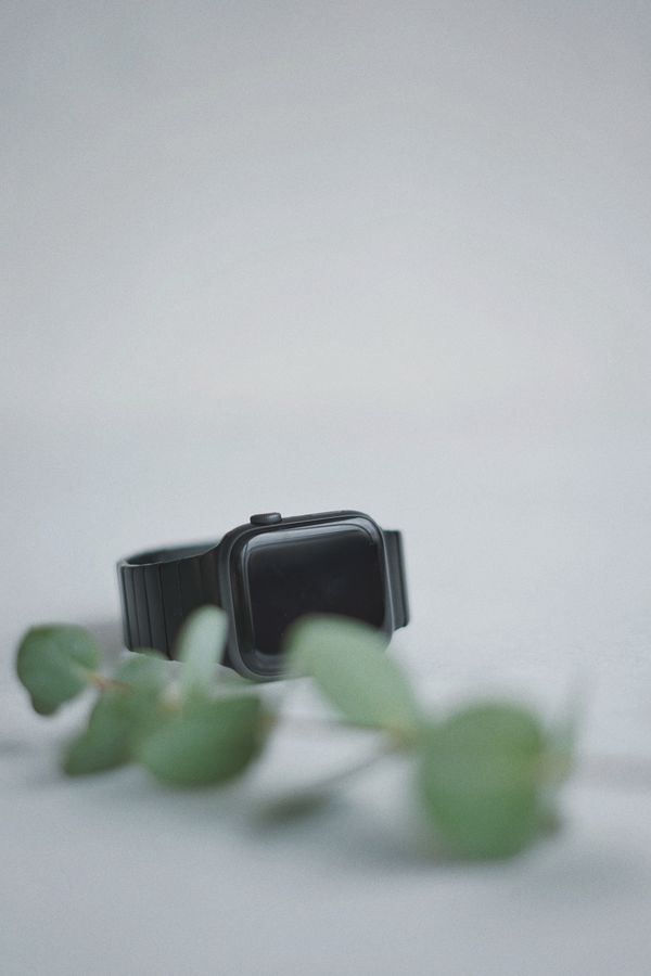 Black smartwatch on a white background, photo by Olena Bohovyk on Pexels
